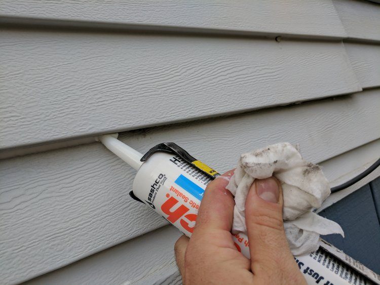 Specialists sealing home exterior entry points 